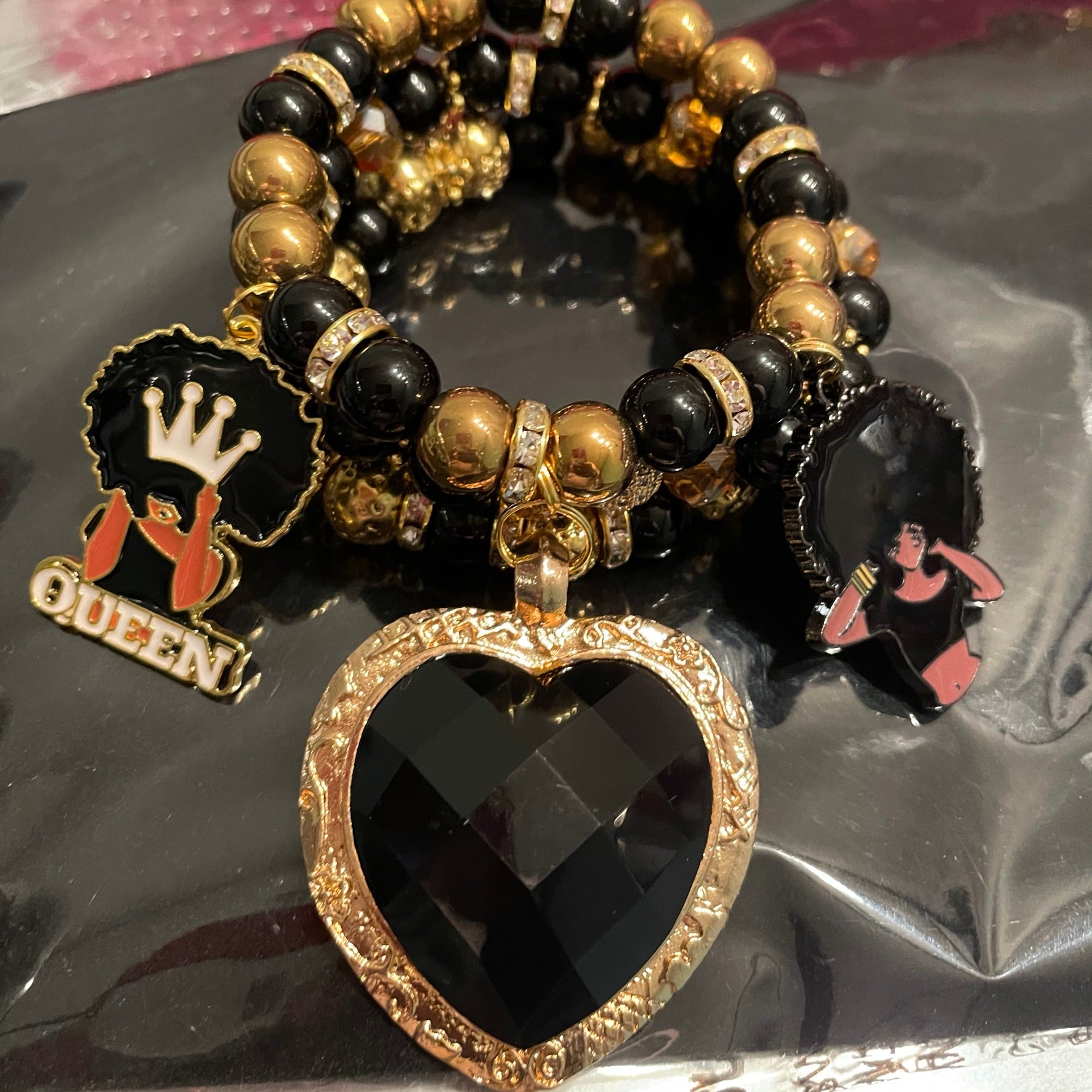 Golden queen bracelets stack